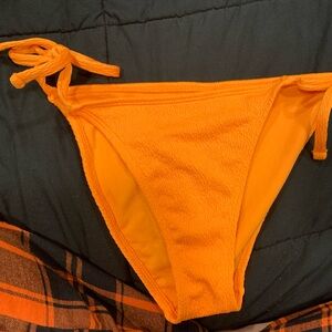 Orange bikini bottom. NWT